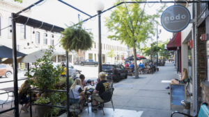 People sitting and eating outdoors.
