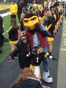 The kid Captain with Herky 