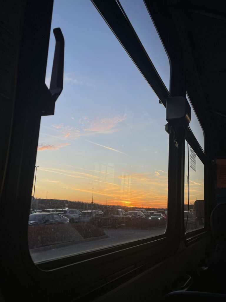 A photo of the sunset from inside the Coralville bus.