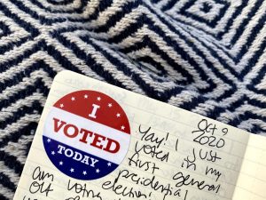 Picture of a notebook with an "I voted today" sticker inside. 
