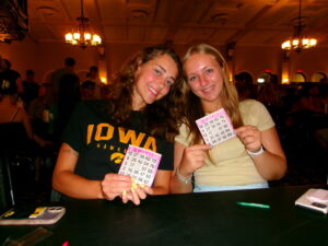 A photo of me and my friend, the one who won the TV, holding up our Bingo cards smiling
