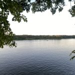 Lake with trees and land in the background